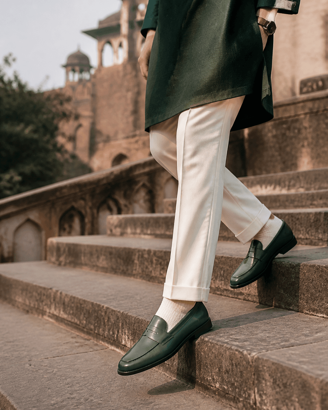 Leather loafers worn on old stone stairs